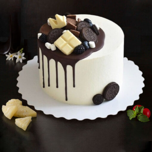 Delicious Oreo chocolaty cake topped with white chocolate, cookies, and fresh fruits – best designer cake for birthdays and celebrations in Guwahati