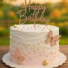 Pink and white butterfly birthday cake with golden pearls, perfect for celebrations in Guwahati