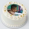 Photo cake Round shape with golden pearl decorations – personalized birthday cake delivery in Guwahati.