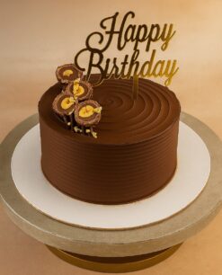 Round Premium Ferrero Rocher chocolate cake for birthday with Happy Birthday topper – available for delivery in Guwahati