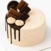 Round premium chocolate overload cake topped with KitKat, Oreo, and chocolate drip – available for delivery in Guwahati