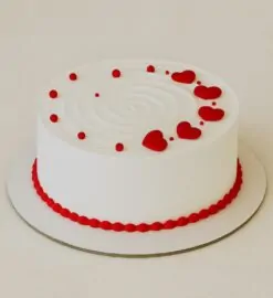 Romantic red hearts cream cake with white frosting, perfect for birthdays and anniversaries in Guwahati – fresh cream and same-day delivery.